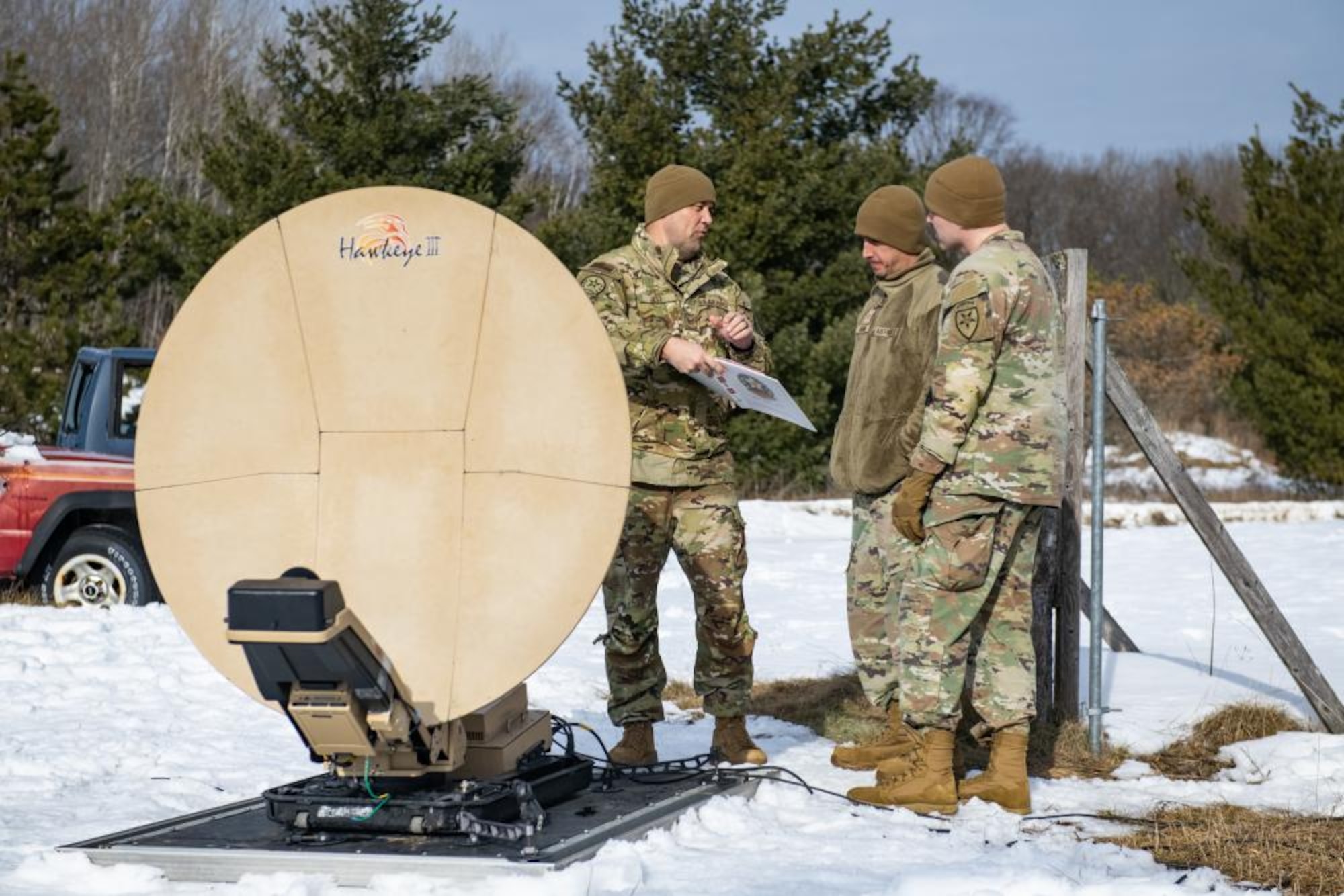 U.S. Air Force Airmen from the 290th Joint Communications Support Squadron set up communication equipment during an exercise, Feb. 13, 2023 at Alpena Combat Readiness Training Center, Michigan. The exercise tested their ability to establish communications in an extreme cold weather environment. (U.S. Air National Guard photo by Senior Airman Jesse Hanson)