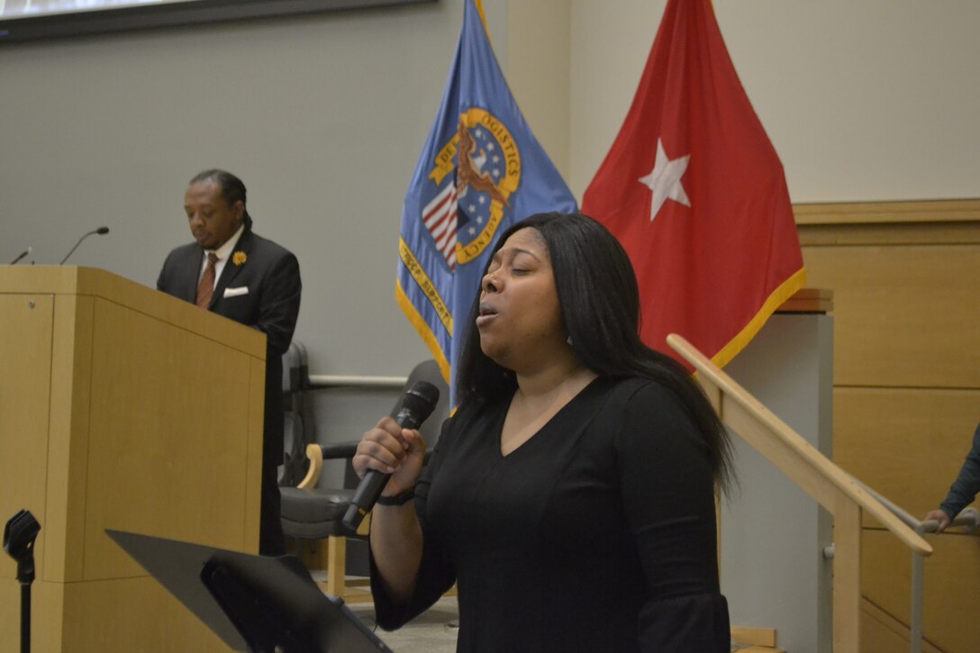LaTosha Wray, Troop Support supply systems analyst, sings the national anthem during DLA Troop Support’s annual Black History Month event February 9 in Philadelphia.