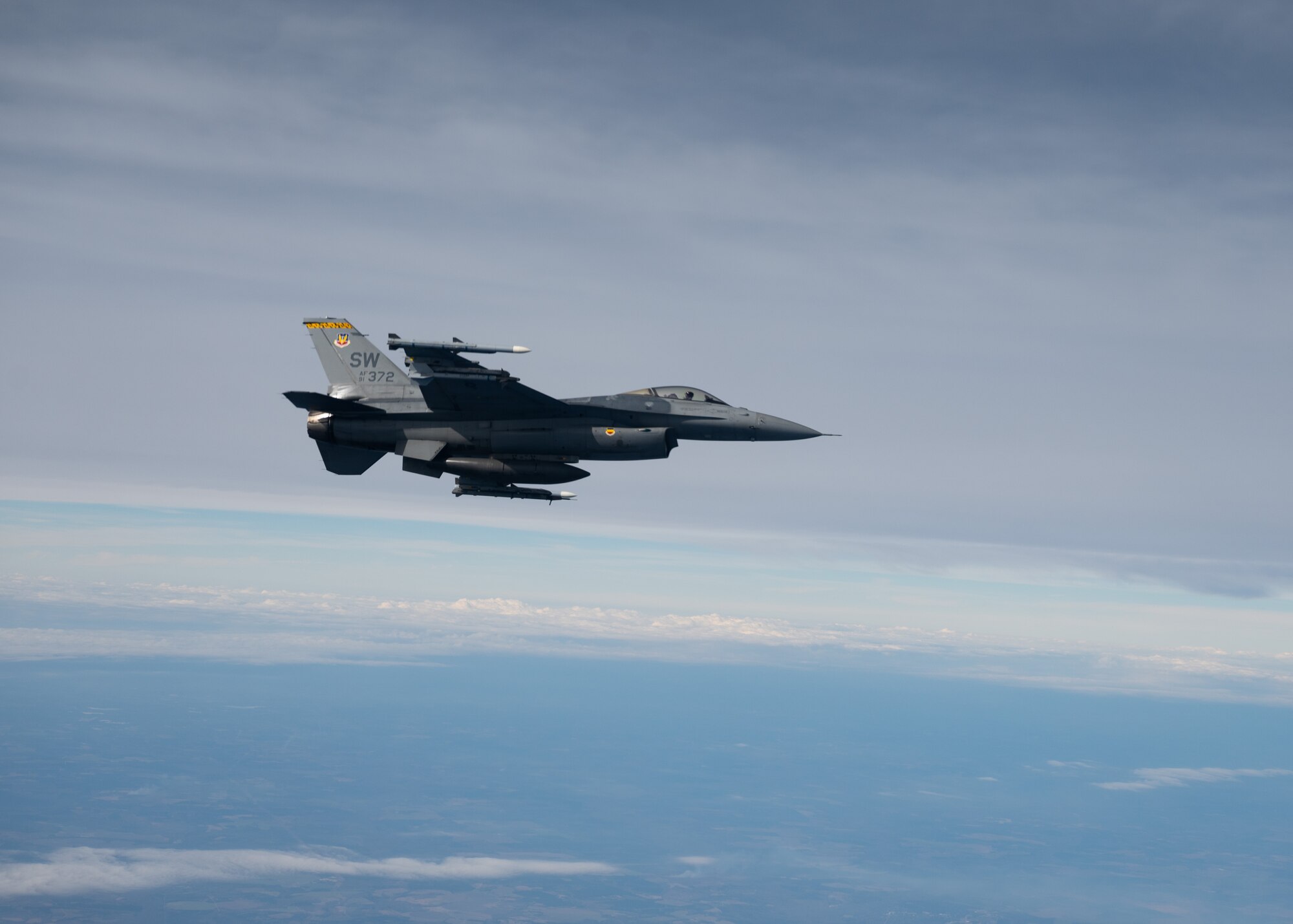 F-16C Fighting Falcon flies alongside KC-135