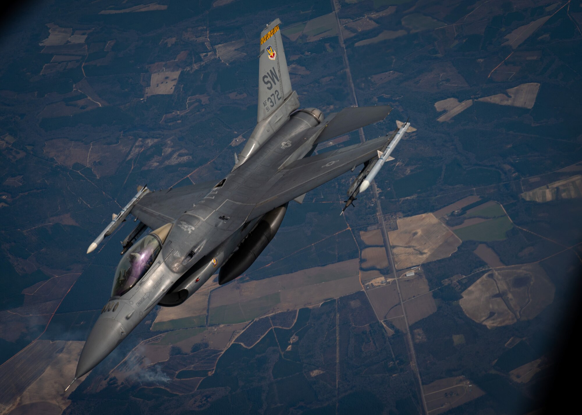 F-16C Fighting Falcon flies alongside KC-135