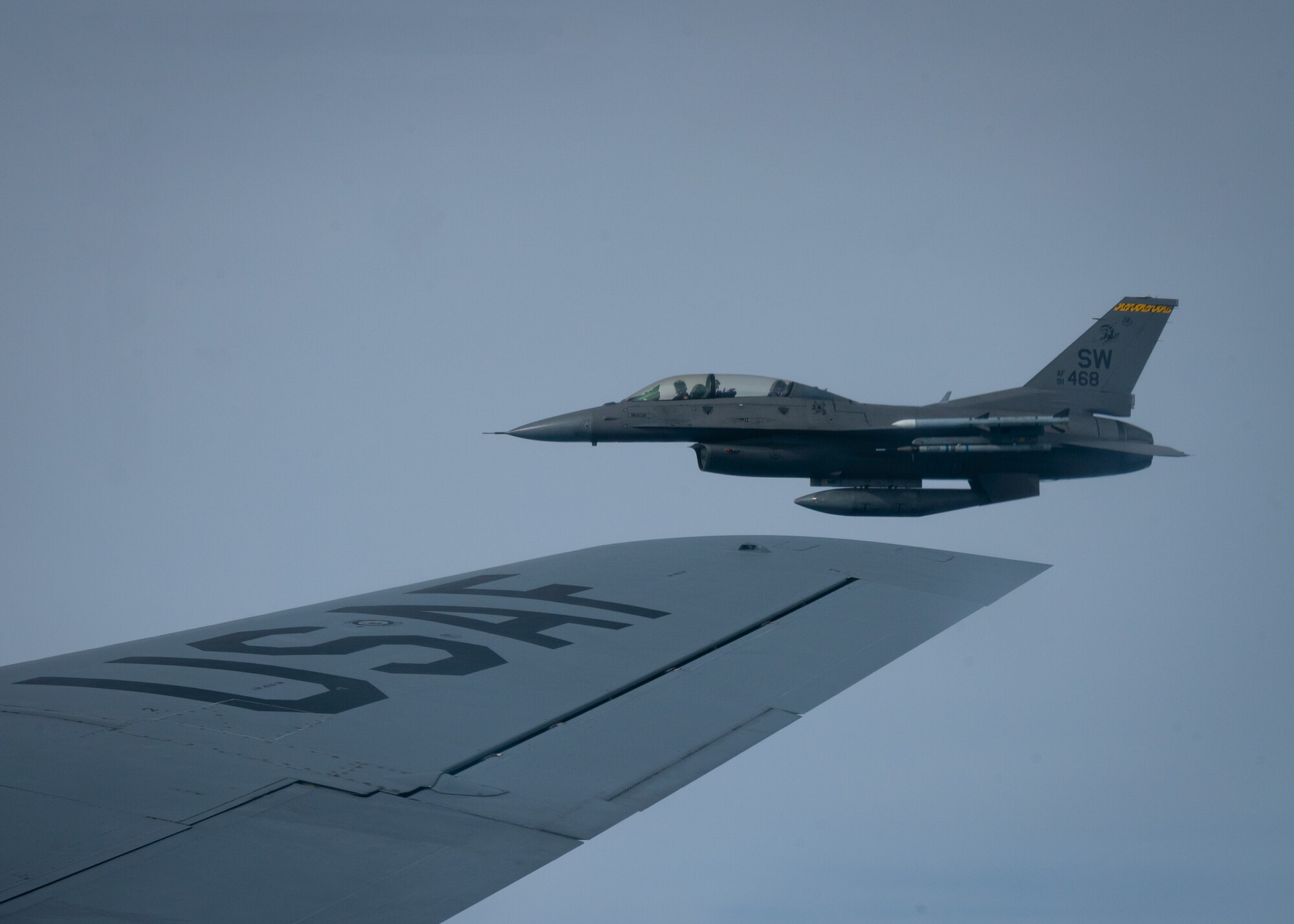 F-16D Fighting Falcon flies alongside KC-135