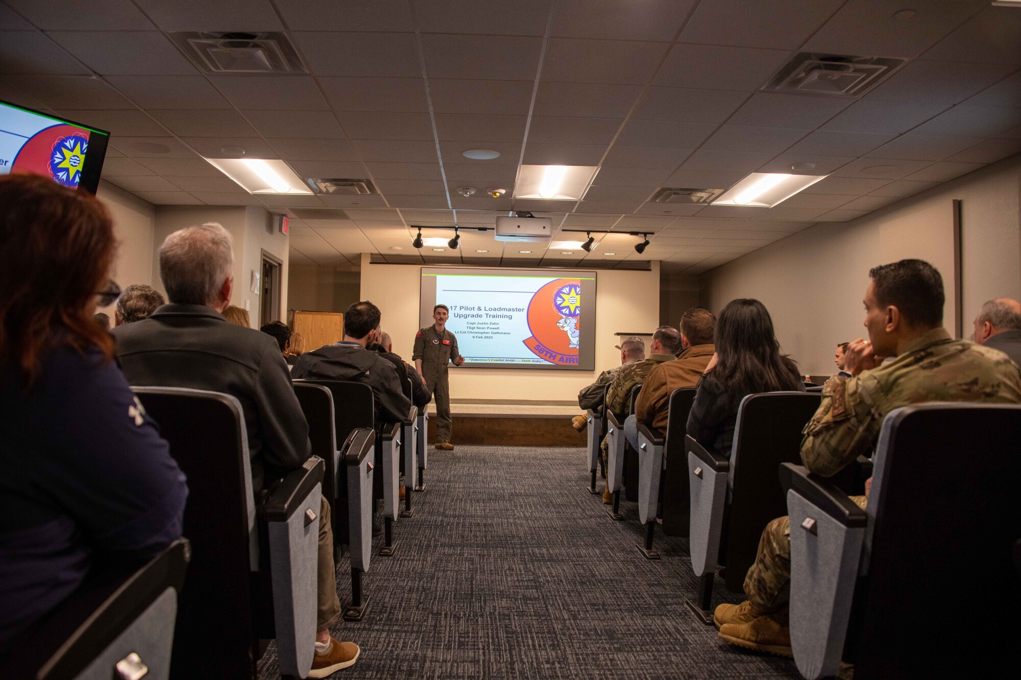 U.S. Air Force Capt. Justin Zahn, 58th Airlift Squadron executive officer, briefs 62nd Airlift Wing(AW) civic leaders at Altus Air Force Base, Oklahoma, Feb. 9, 2023. Zahn, who was previously stationed with the 62nd AW, showed the leaders what upgrade training looks like for loadmasters on the C-17 Globemaster III. (U.S. Air Force photo by Airman 1st Class Kari Degraffenreed)