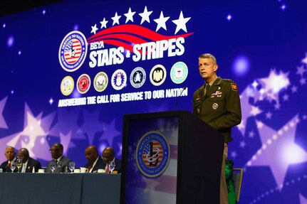 General Daniel Hokanson stands behind a podium while speaking to the audience at the 37th annual Black Engineer of the Year awards ceremony.