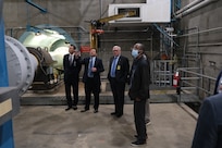 Matthew Brantz (second to left), Site Director of Naval Surface Warfare Center, Carderock Division’s Memphis Detachment, shows University of Memphis (UofM) President Dr. Bill Hardgrave (left), Dr. Eddie Jacobs (second to right), professor of electrical and computer engineering, as well as Wiley Henry, a staff member for U.S. Representative Steve Cohen, the motor and shaft of the Large Cavitation Channel (LCC) at Carderock’s Memphis Detachment in Tennessee during a tour on Feb. 6. (U.S. Navy photo by Todd Hurley)