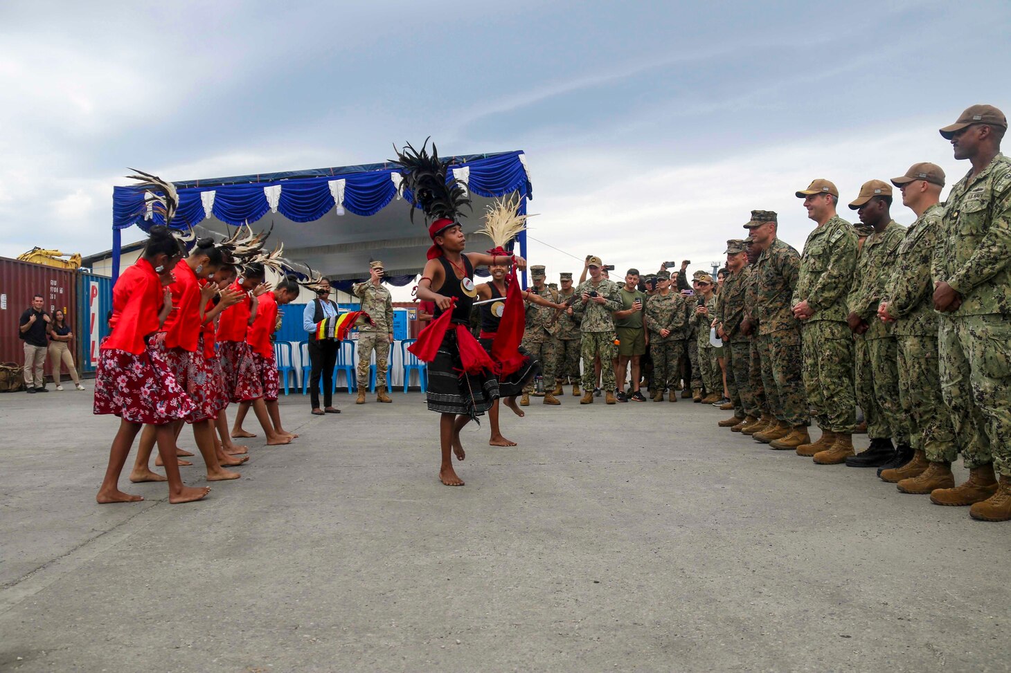 Sailors from amphibious transport dock ship USS John P. Murtha (LPD 26), are greeted with a traditional dance by representatives of Timor-Leste for Cooperation Afloat Readiness and Training (CARAT)/Marine Exercise (MAREX) 2023 in Dili, Feb. 10, 2023. CARAT/MAREX Timor-Leste is a bilateral exercise between Timor-Leste and the United States designed to promote regional security cooperation, maintain and strengthen maritime partnerships, and enhance maritime interoperability. In its 28th year, the CARAT series is comprised of multinational exercises, designed to enhance U.S. and partner forces’ abilities to operate together in response to traditional and non-traditional maritime security challenges in the Indo-Pacific region. (U.S. Navy photo by Mass Communication Specialist 2nd Class Joshua Samoluk)