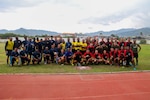 Sailors and Marines, assigned to amphibious transport dock ship USS John P. Murtha (LPD 26), pose for a photo after a game of football with members of the Timor-Leste Defense Force (F-FDTL) during the opening ceremony of Cooperation Afloat Readiness and Training (CARAT)/Marine Exercise (MAREX) 2023 in Dili, Feb. 10, 2023. CARAT/MAREX Timor-Leste is a bilateral exercise between Timor-Leste and the United States designed to promote regional security cooperation, maintain and strengthen maritime partnerships, and enhance maritime interoperability. In its 28th year, the CARAT series is comprised of multinational exercises, designed to enhance U.S. and partner forces’ abilities to operate together in response to traditional and non-traditional maritime security challenges in the Indo-Pacific region. (U.S. Navy photo by Mass Communication Specialist 2nd Class Joshua Samoluk)