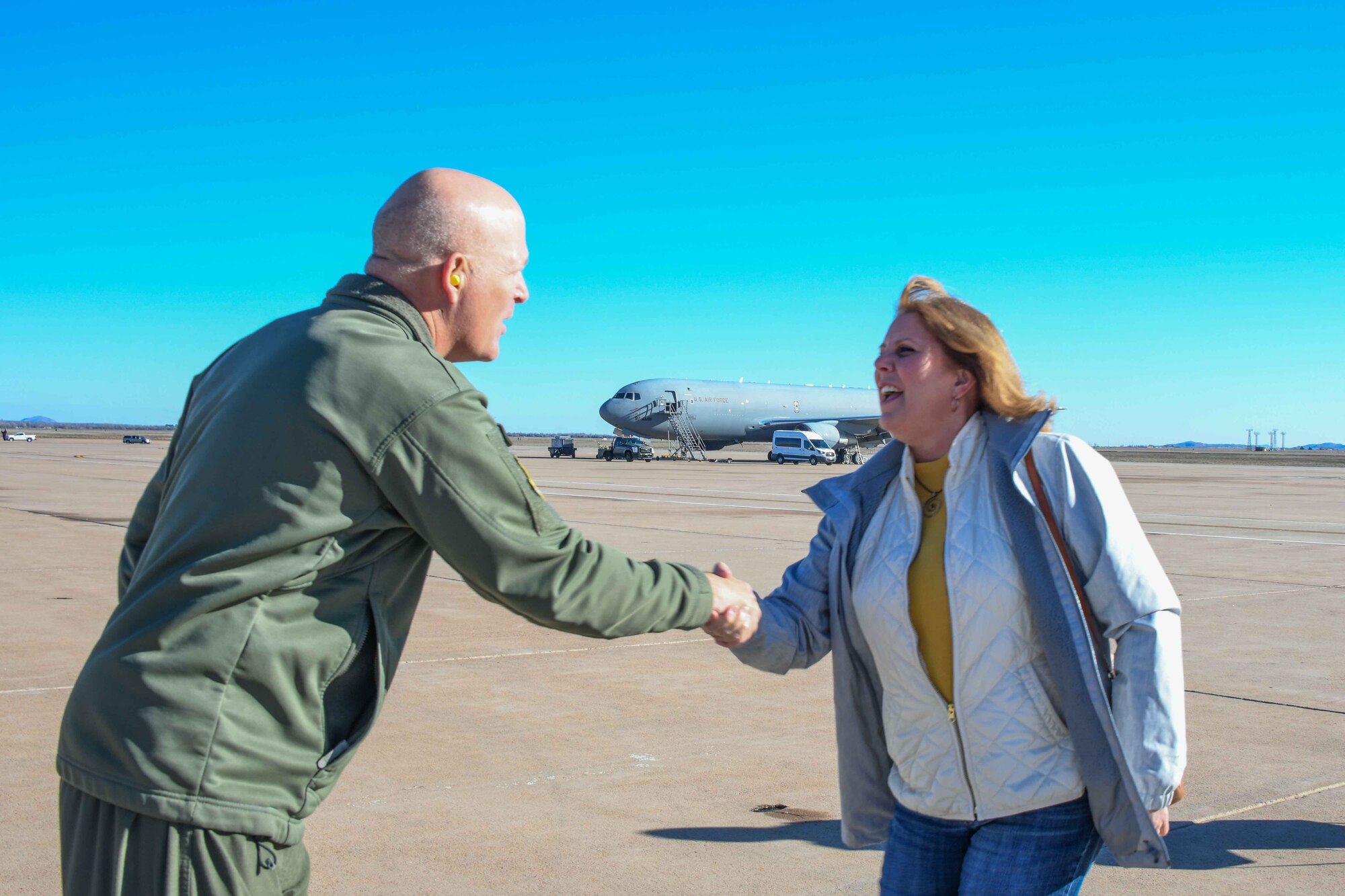 U.S. Air Force Col. Blaine Baker, 97th Air Mobility Wing commander, welcomes Jaimie Garrett,62nd Airlift Wing honorary commander, to Altus Air Force Base (AAFB), Oklahoma, Feb. 9,2023. The tour of AAFB was the third and final stop for the civic leader tour of three different Air Force bases. (U.S. Air Force photo by Airman 1st Class Kari Degraffenreed)