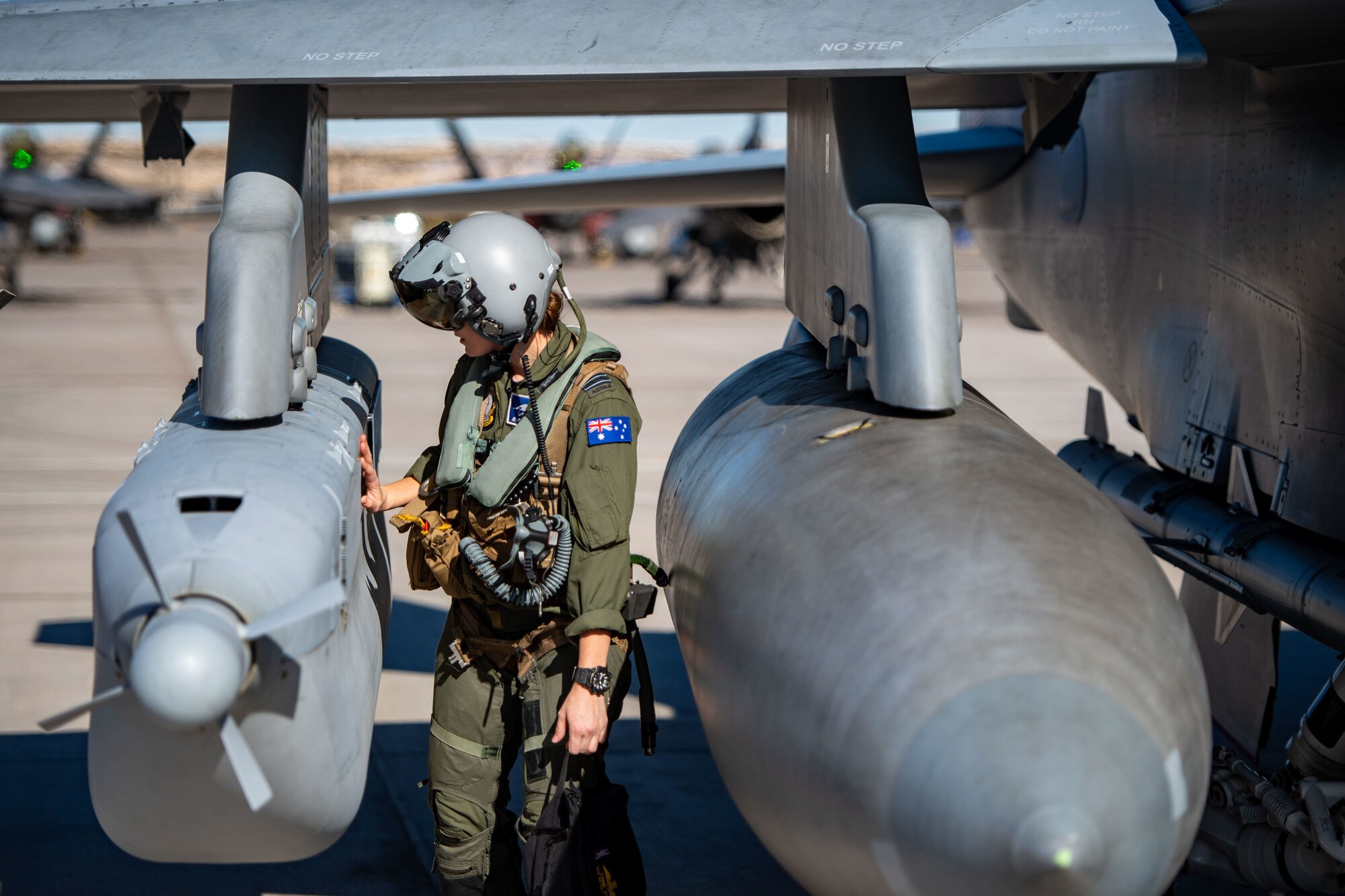 Flight Lietutenant Connie Dixon of the Royal Australian Air Force No. 6 Squadron performs a final inspection on an EA-18G Growler before a flying mission during Red Flag 23-1 on Nellis Air Force Base, Nevada, Jan. 31, 2023. The E/A-18G is cooperatively operated between the U.S. Navy and the Royal Australian Air Force. (U.S. Air Force photo by Staff Sgt. Michael Jones)