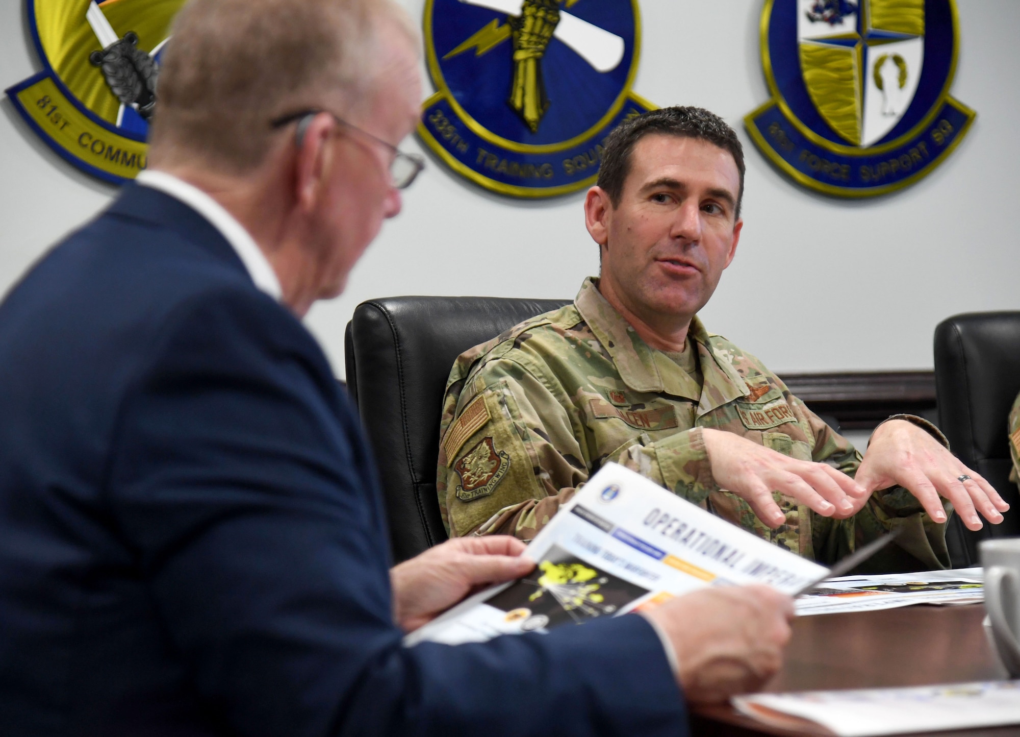 U.S. Air Force Col. Jason Allen, 81st Training Wing commander, delivers the wing mission brief to Congressman Mike Ezell, South Mississippi 4th Congressional District representative, and his staff, during an immersion tour inside the headquarters building at Keesler Air Force Base, Mississippi, Feb. 15, 2023.