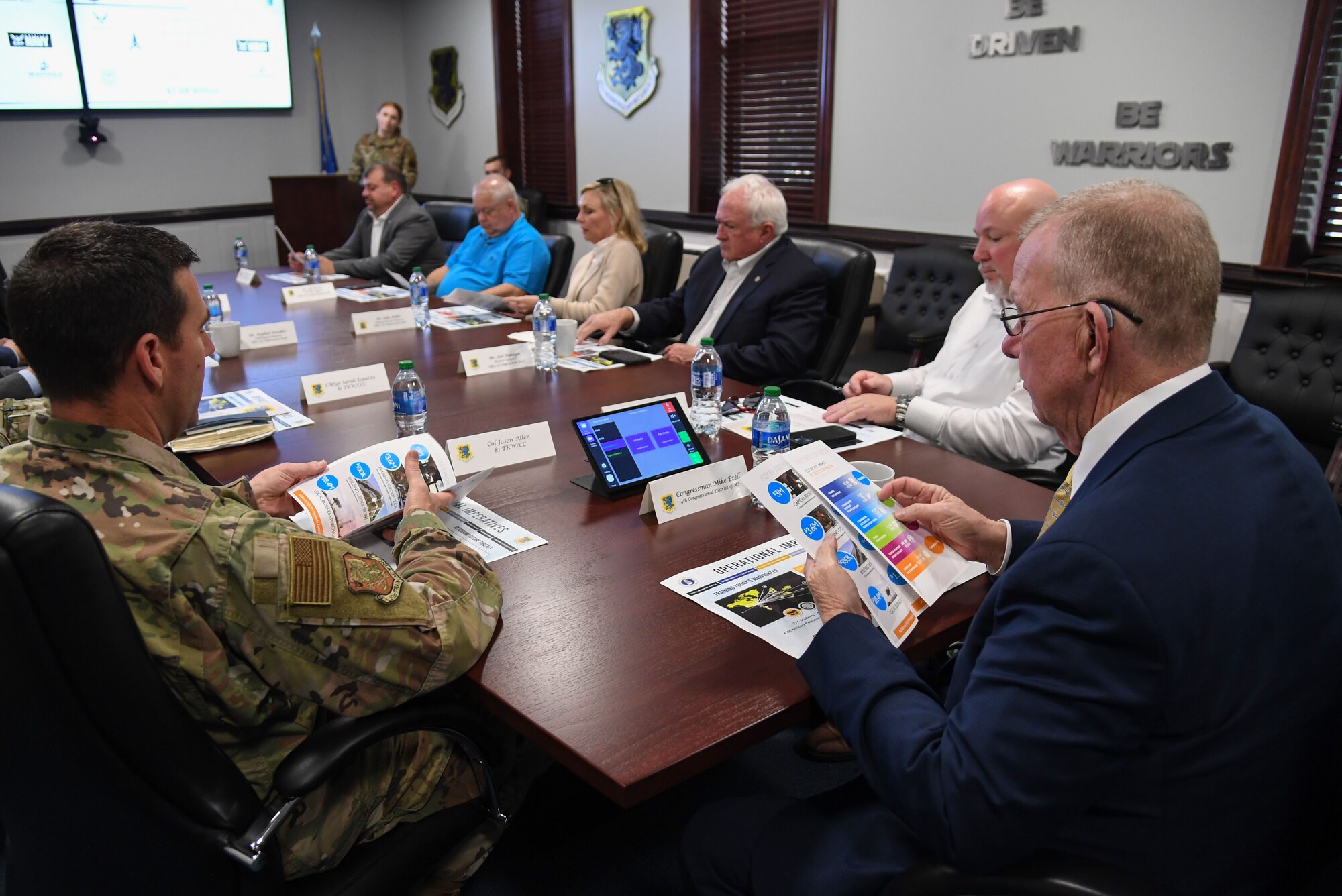 U.S. Air Force Col. Jason Allen, 81st Training Wing commander, delivers the wing mission brief to Congressman Mike Ezell, South Mississippi 4th Congressional District representative, and his staff, during an immersion tour inside the headquarters building at Keesler Air Force Base, Mississippi, Feb. 15, 2023.