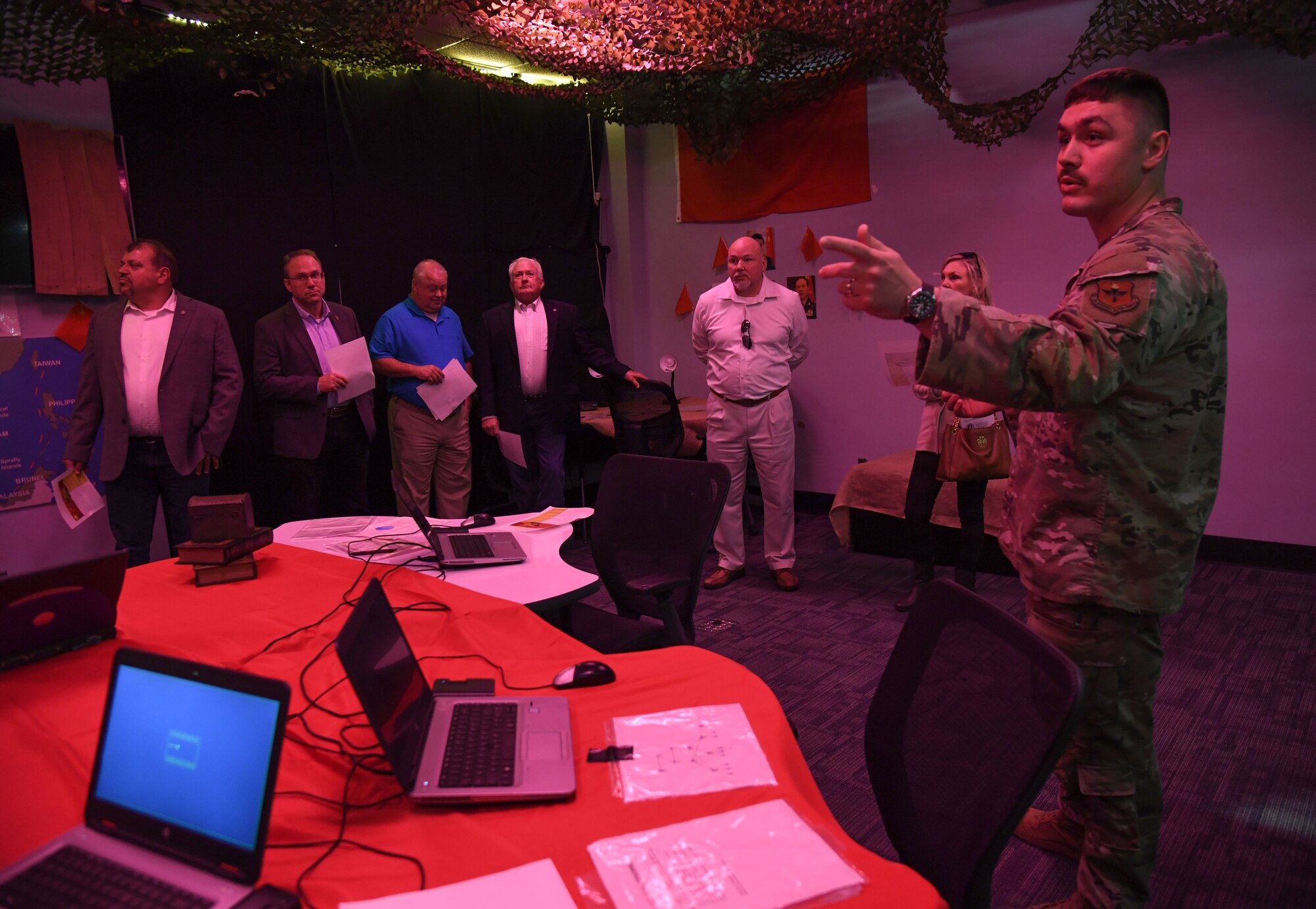 U.S. Air Force 1st Lt. Jesse Perkins, 333rd Training Squadron instructor, provides an overview of the cyber warfare training capabilities inside the 333rd TRS escape room to staff members of Congressman Mike Ezell, South Mississippi 4th Congressional District representative, during an immersion tour inside Stennis Hall at Keesler Air Force Base, Mississippi, Feb. 15, 2023.
