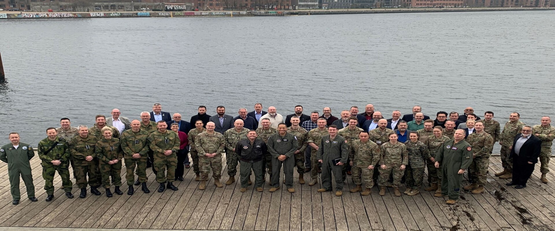 Military personnel from the United States, Denmark, Norway, Finland and Sweden pose for a photograph during a conference focused on sharing airspace information in Copenhagen, Denmark, in January 2023. The New York Air National Guard's 152nd Air Operations Group sent a delegation of three officers to the meeting.