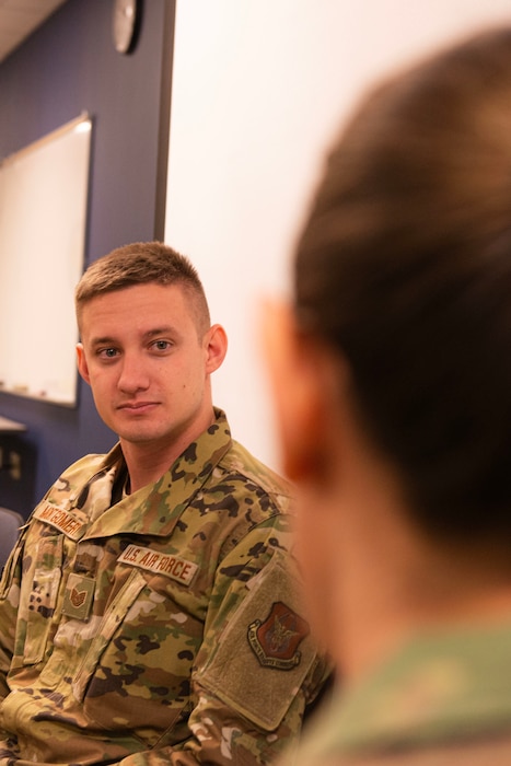 Tech Sgt. Dylan Montgomery, 934th Aircraft Maintenace Squadron crew chief, listens to an Airman roleplaying a victim of sexual assault during Sexual Assault Prevention and Response training at Minneapolis-St. Paul Air Reserve Station, Minn., Jan. 24, 2023. The 934th Airlift Wing Sexual Assault Prevention and Response Office redesigned the annual SAPR training with a roleplaying scenario.