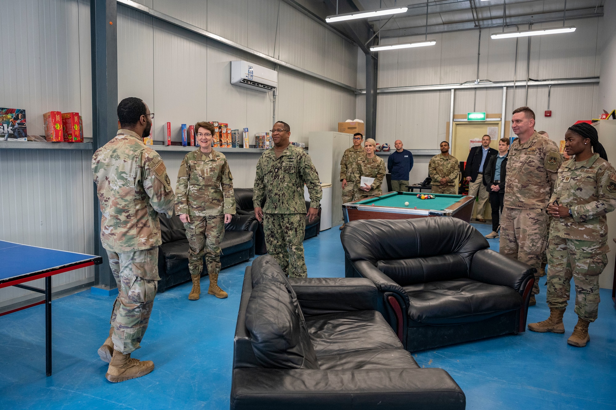 U.S. Air Force Gen. Jacqueline D. Van Ovost, U.S. Transportation Command commander, and U.S. Navy Fleet Master Chief Donald O. Myrick, USTRANSCOM senior enlisted leader, tour the Morale, Welfare and Recreation center at Cargo City, Kuwait, Feb. 10, 2023.