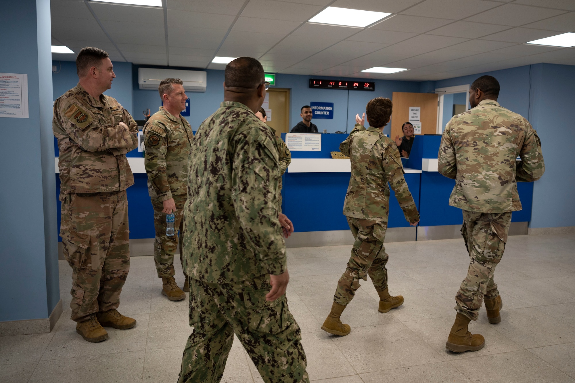 U.S. Air Force Gen. Jacqueline D. Van Ovost, U.S. Transportation Command commander, waves to passenger terminal employees during her tour at Cargo City, Kuwait, Feb. 10, 2023.