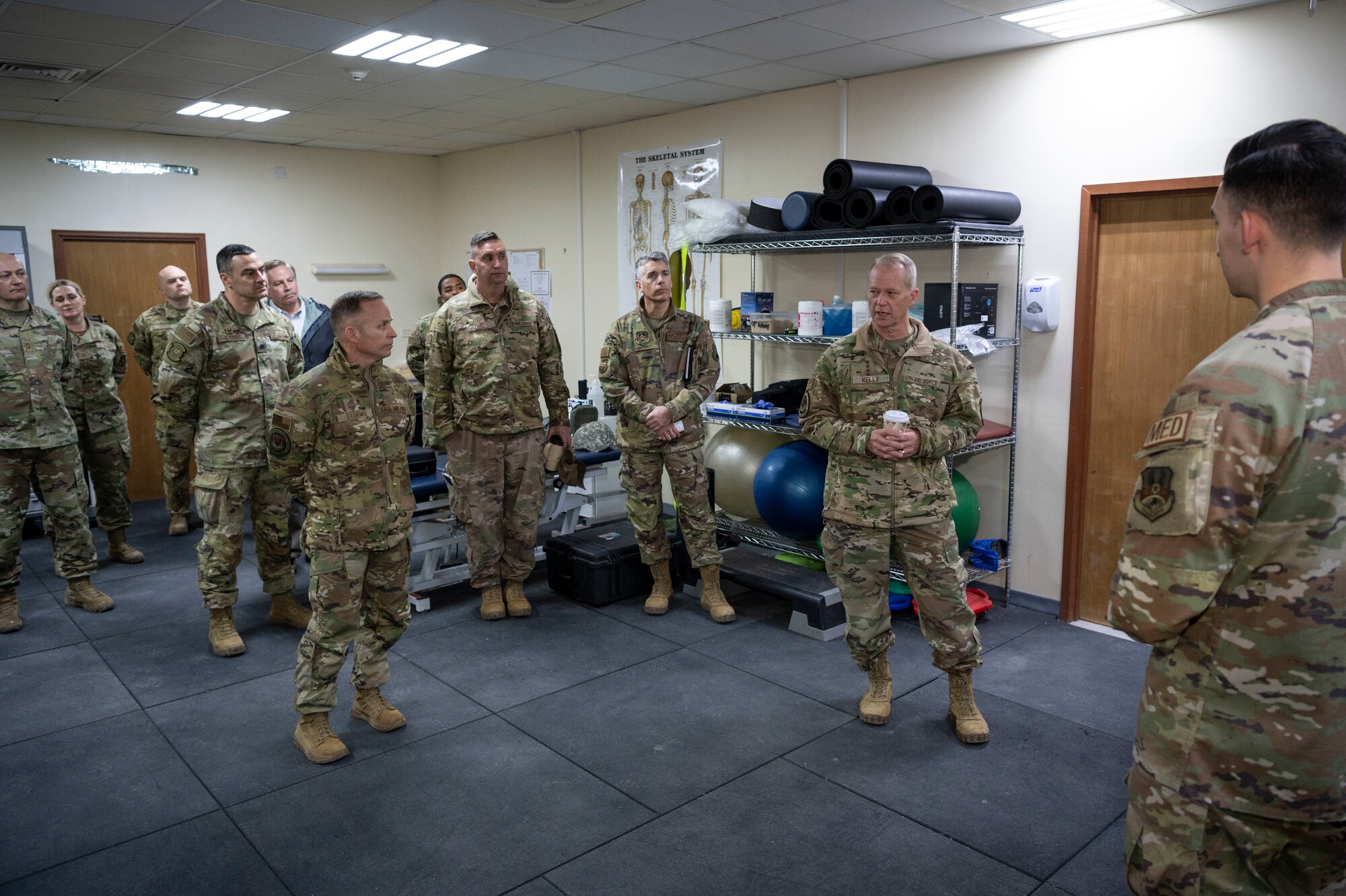 U.S. Air Force Gen. Mark Kelly, commander of Air Combat Command and Command Chief Master Sgt. John Storms, ACC, learn about physical therapy benefits offered to Airmen during a tour at Ali Al Salem Air Base, Kuwait, Feb. 15, 2023.