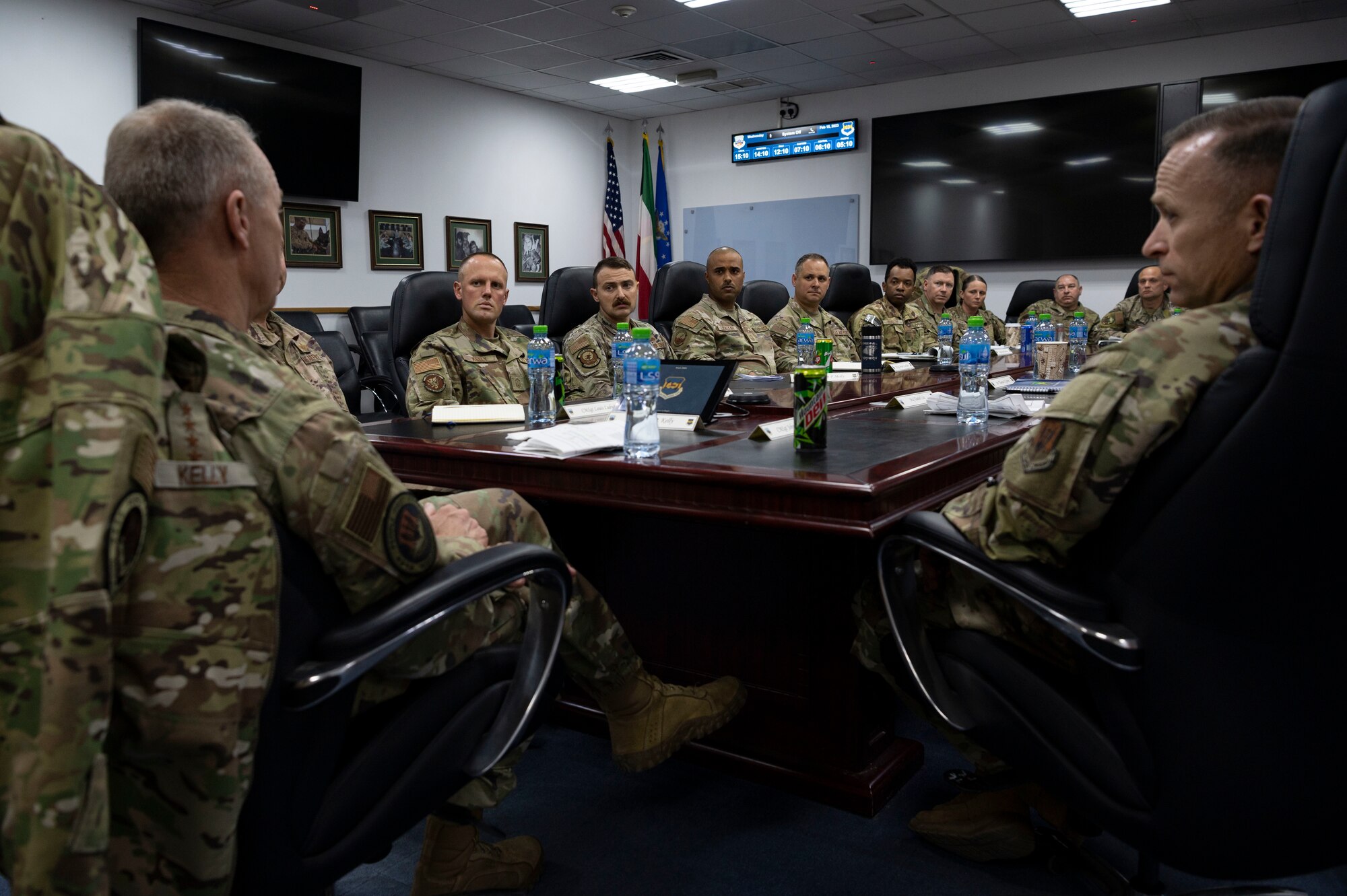 U.S. Air Force Gen. Mark Kelly, commander of Air Combat Command, and Command Chief Master Sgt. John Storms, ACC, talk to Senior Non-Commissioned Officers during a tour at Ali Al Salem Air Base, Kuwait, Feb. 15, 2023.
