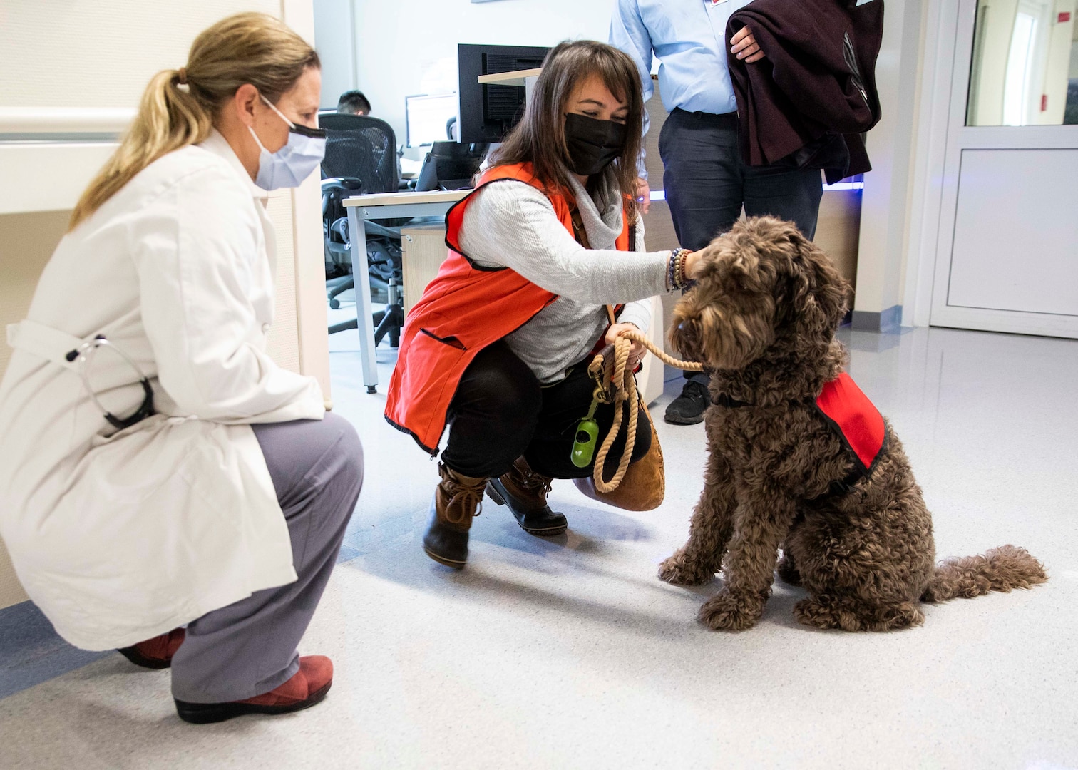 Staff at Landstuhl Regional Medical Center’s Medical-Surgical Ward, visit with Saif and DeDe Musa, American Red Cross volunteers, during Saif’s first day volunteering with the Landstuhl American Red Cross Pet Visitation Program, at Landstuhl Regional Medical Center, Jan. 19.