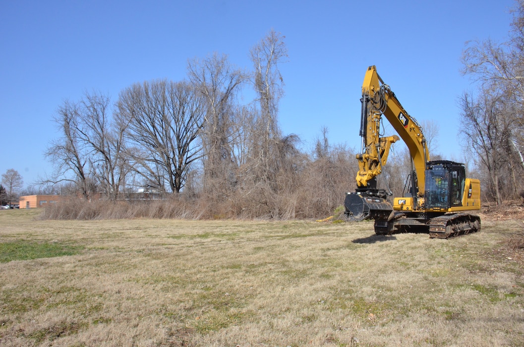 Contractors working for the U.S. Army Corps of Engineers (USACE) clear a large swath of densely-wooded brush (approx. 700-foot by 50-foot-wide area) located approximately two football fields away from Jana Elementary School in Florissant, Missouri, to allow surveyors to thoroughly analyze the topography of the area. The data collected will be used to inform the project team as they develop their plan to remediate low-level contamination that was identified at the bottom of a steep creek bank as part of ongoing remediation activities under the Formerly Utilized Sites Remedial Action Program (FUSRAP). This remediation work is scheduled to begin later this summer. In addition to advancing ongoing remediation efforts along Coldwater Creek authorized under FUSRAP, USACE performed comprehensive sampling efforts inside and outside Jana Elementary School in late 2022 that concluded from a radiological standpoint, the school is safe. USACE will continue to prioritize the health and well-being of the community, guided by data-driven decisions.  (USACE Photo by JP Rebello)