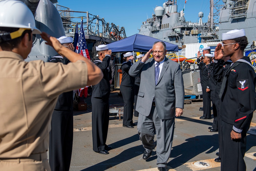 Secretary of the Navy Carlos Del Toro is piped aboard the Ticonderoga-class guided missile cruiser USS Cowpens (CG 63) during a visit.