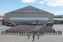 U.S. Air Force Airmen from the 104th Fighter Wing, Massachusetts Air National Guard pose for a wing group photo on the flightline June 12, 2022 at Barnes Air National Guard Base, Massachusetts. The mission of the 104FW is to prepare and deploy in support of domestic, humanitarian and combat operations anywhere in the world. (U.S. Air National Guard photo by Staff Sgt. Hanna Smith)