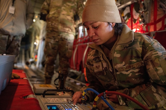 Staff Sgt. Rachelle Beverly, 934th Maintenance Squadron instruments and flight control systems technician, operates the air pressure system at Minneapolis-St. Paul Air Reserve Station, Feb. 2, 2023. This is used to check the operating system to make sure it works. (U.S. Air Force photo by Senior Airman Colten Tessness)
