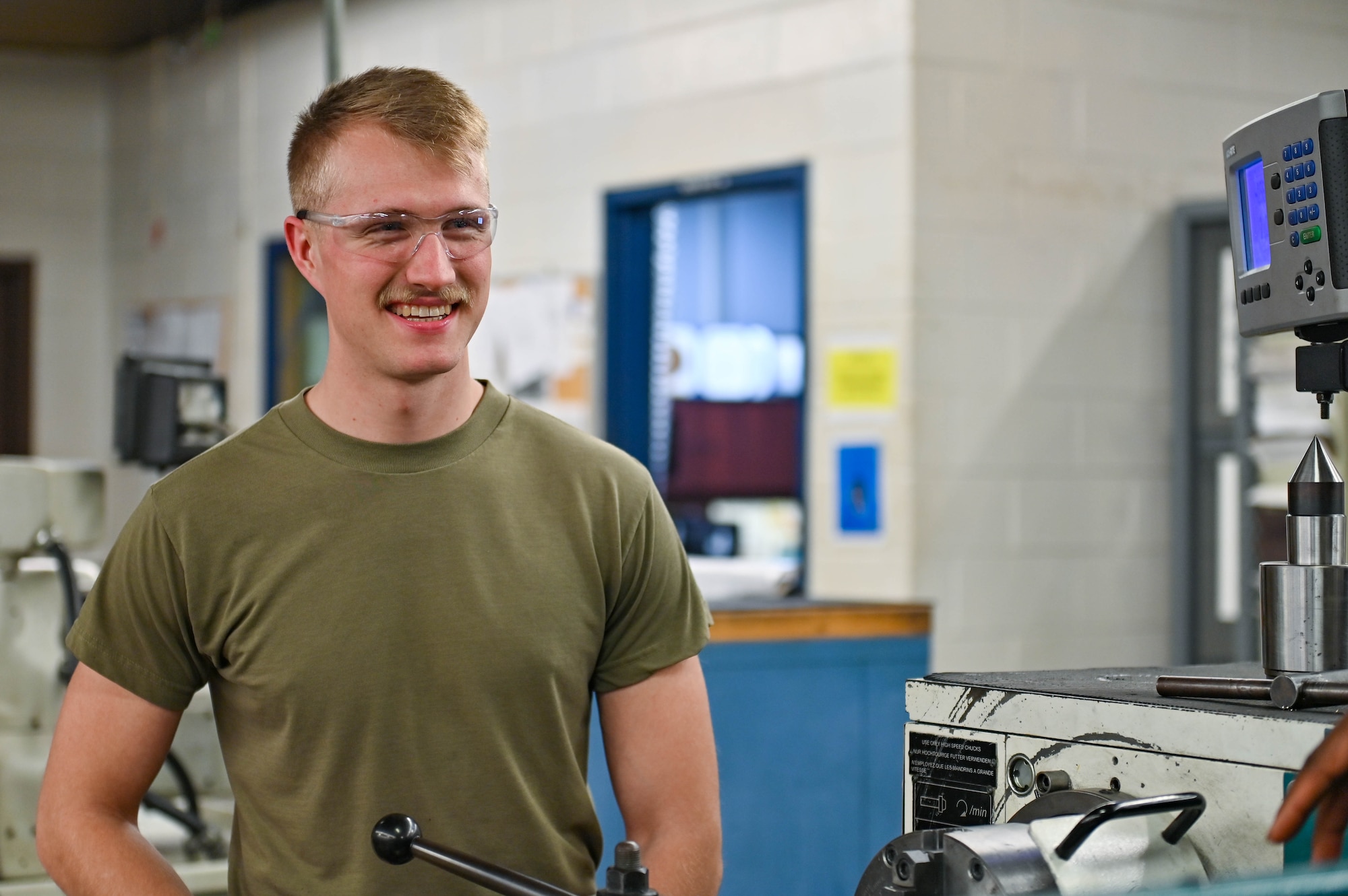 U.S. Air Force Senior Airman Cameron Balon, 23rd Maintenance Squadron aircraft metals technician, discusses equipment techniques with a non-commissioned officer at Moody Air Force Base, Georgia, Dec. 19, 2022. Learning new techniques and passing experience along to newer Airmen encourages innovative processes and technical experts. (U.S. Air Force photo by Senior Airman Rebeckah Medeiros)