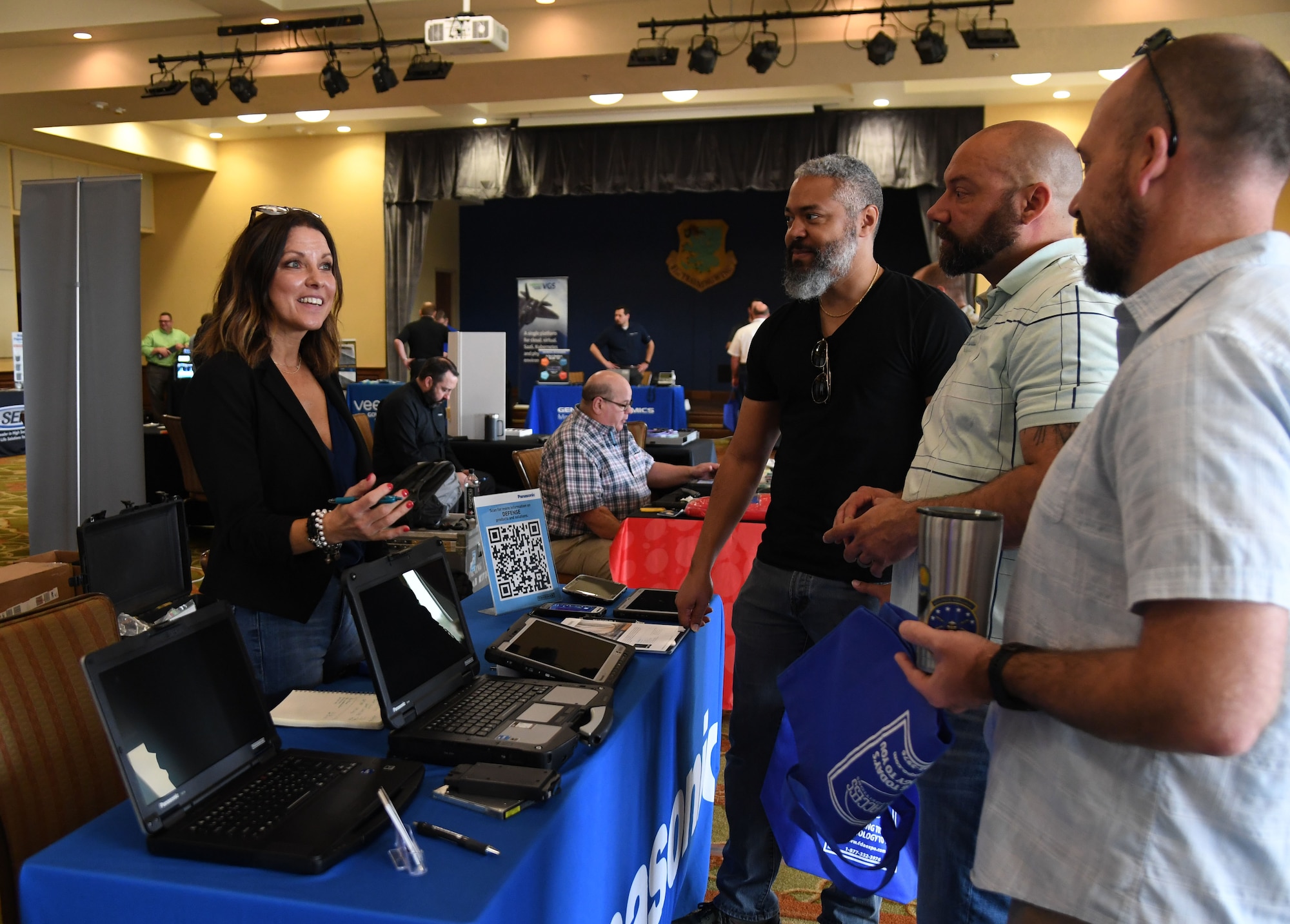 Julie McCabe, Panasonic rugged mobility equipment senior account manager, provides an equipment overview to Keesler personnel during the Technology Expo inside the Bay Breeze Event Center at Keesler Air Force Base, Mississippi, Feb. 16, 2023.