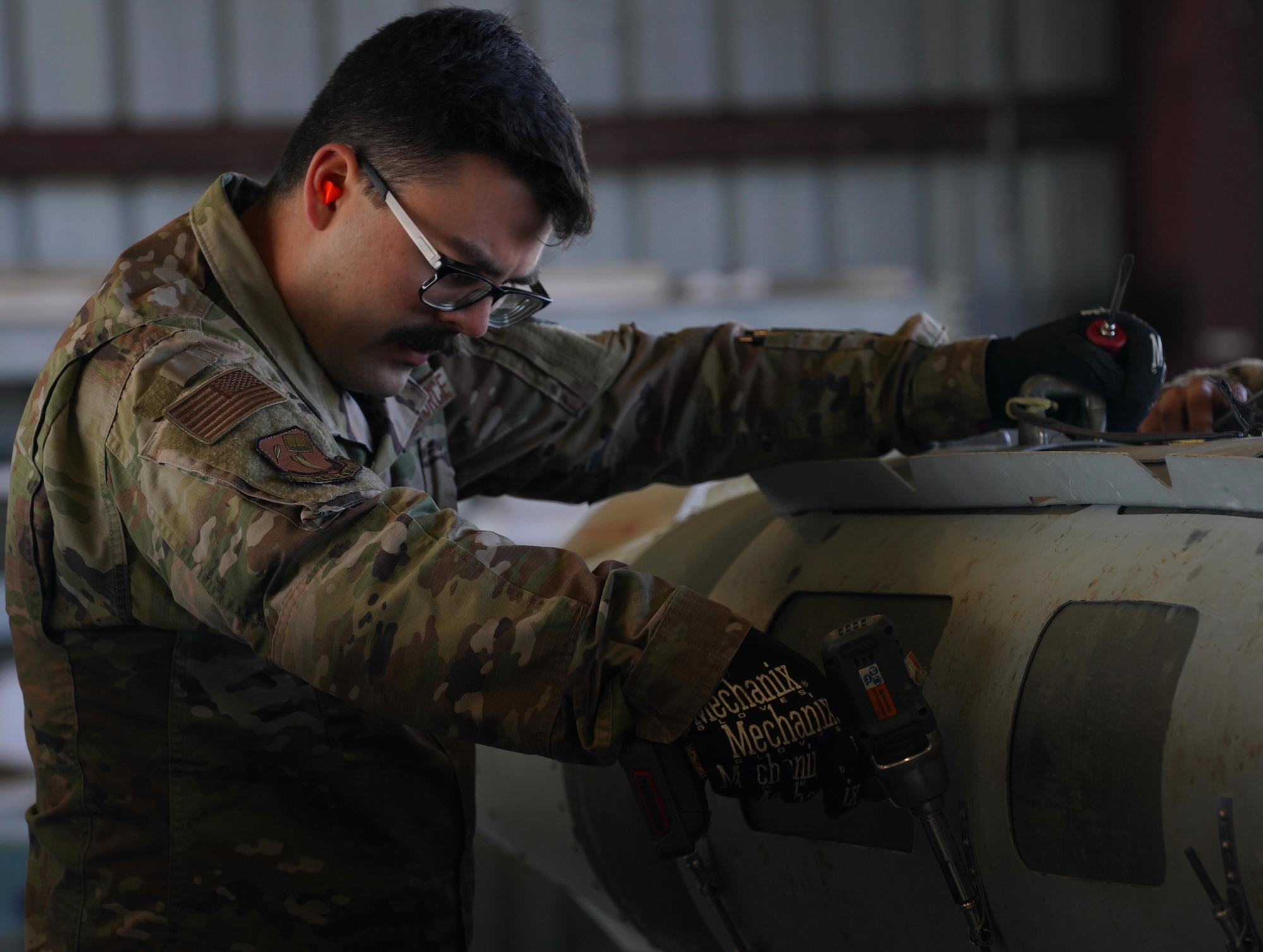 U.S. Air Force Senior Airman Tyler Klemp, 9th Munitions Squadron storage technician, disassembles a bomb on Feb. 8, 2023, at Beale Air Force Base, Calif.