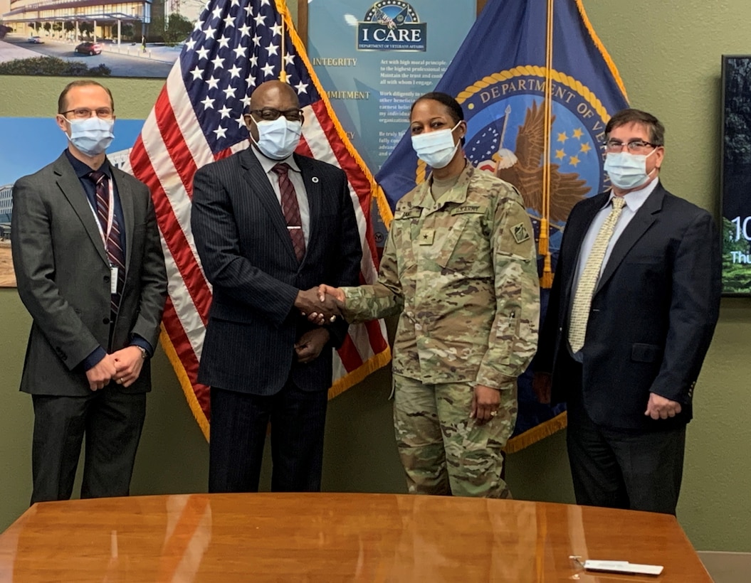 U.S. Army Corps of Engineer South Pacific Division Commander Brig. Gen. Antoinette Gant, right center, met with Phoenix VA Health Care System Director Bryan Matthews, left center, during a project site visit Feb. 2 at the Carl T. Hayden VA Medical Center in Midtown Phoenix. John Drake, LA District chief of International and Interagency Services, far right, and Elijah Ditter, Phoenix VA Associate Director of Resources, far left, also were among the senior leaders discussing the future projects. (Photo by Robert DeDeaux, USACE PAO)