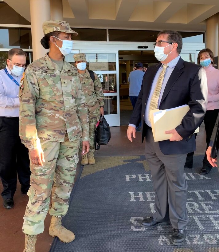 U.S. Army Corps of Engineer South Pacific Division Commander Brig. Gen. Antoinette Gant, left, John Drake, chief of the Corps’ Los Angeles District International and Interagency Services, right, discuss current and future VA Medical Center projects during a tour of the Carl T. Hayden VA Medical center Feb. 2 in Midtown Phoenix.
