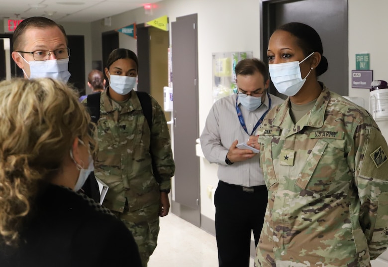 U.S. Army Corps of Engineer South Pacific Division Commander Brig. Gen. Antoinette Gant, right, converses with a Phoenix VA Health Care Systems nurse, foreground left, during a tour of the Carl T. Hayden VA Medical center Feb.2 in Midtown Phoenix. The Corps’ LA District, in partnership with the Phoenix VA Medical Care System, are collaborating on six projects at the medical center. (Photo by Robert DeDeaux, USACE PAO)