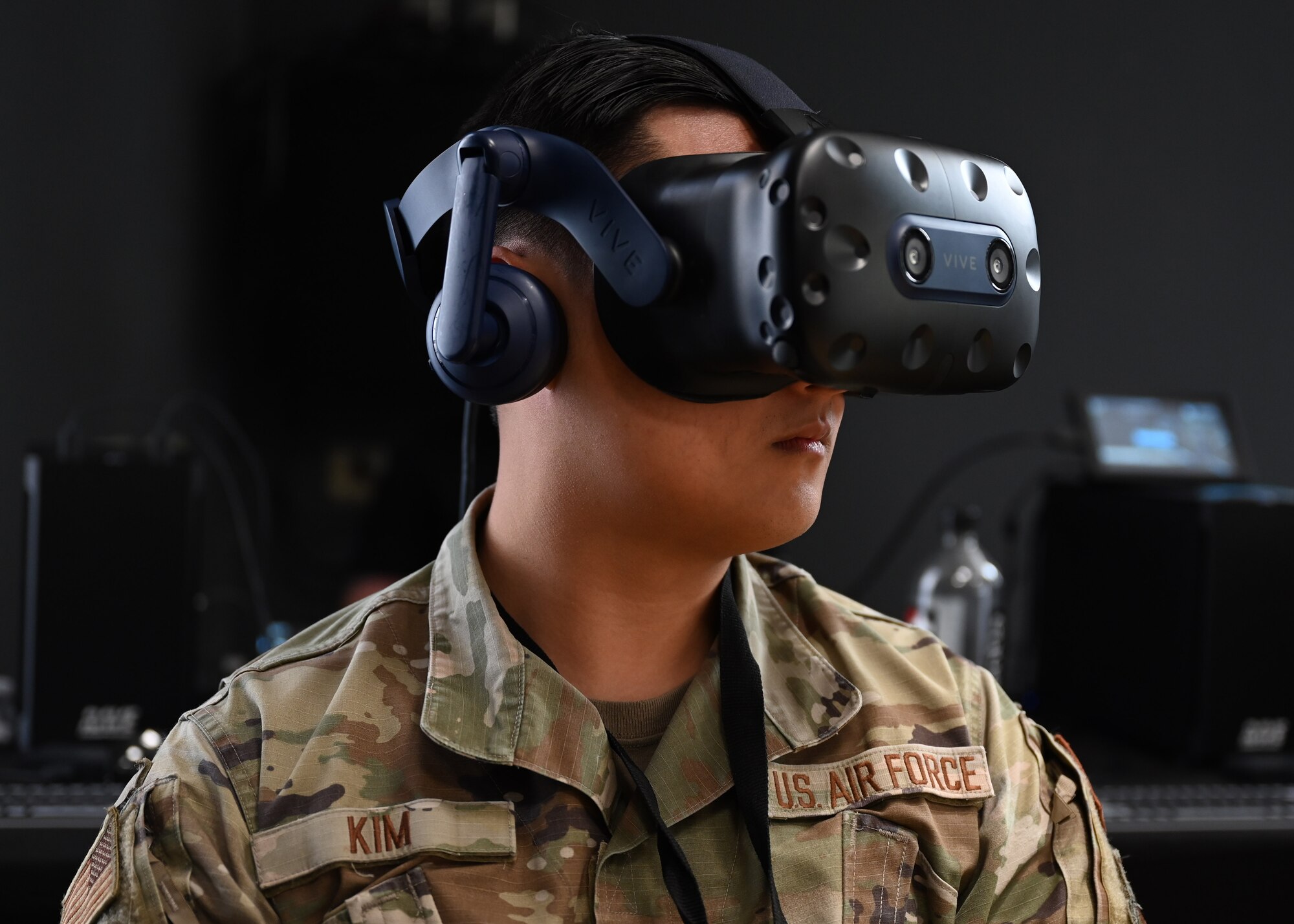 U.S. Air Force 1st Lt. Uibin Kim, 17th Contracting Squadron contract specialist, uses a virtual reality headset at the Mass Virtual booth at Industry Days in the Powell Event Center, Goodfellow Air Force Base, Texas, Feb. 16, 2023. Industry partners met with their intended users to fine-tune their products and programs to meet end-user needs. (U.S. Air Force photo by Senior Airman Ethan Sherwood)