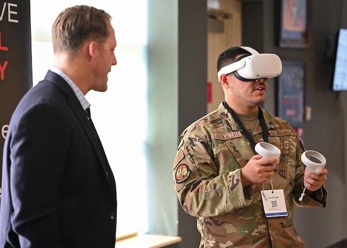 Jedburgh Technology Founder Jason Starkey, walks U.S. Air Force Airman 1st Class Gonzalo Loaiza Alzate, 17th Contracting Squadron contract specialist, through a demonstration during Industry Days in the Powell Event Center, Goodfellow Air Force Base, Texas, Feb. 15, 2023. Live demos were presented by industry partners as an example of their capabilities. (U.S. Air Force photo by Senior Airman Ethan Sherwood)