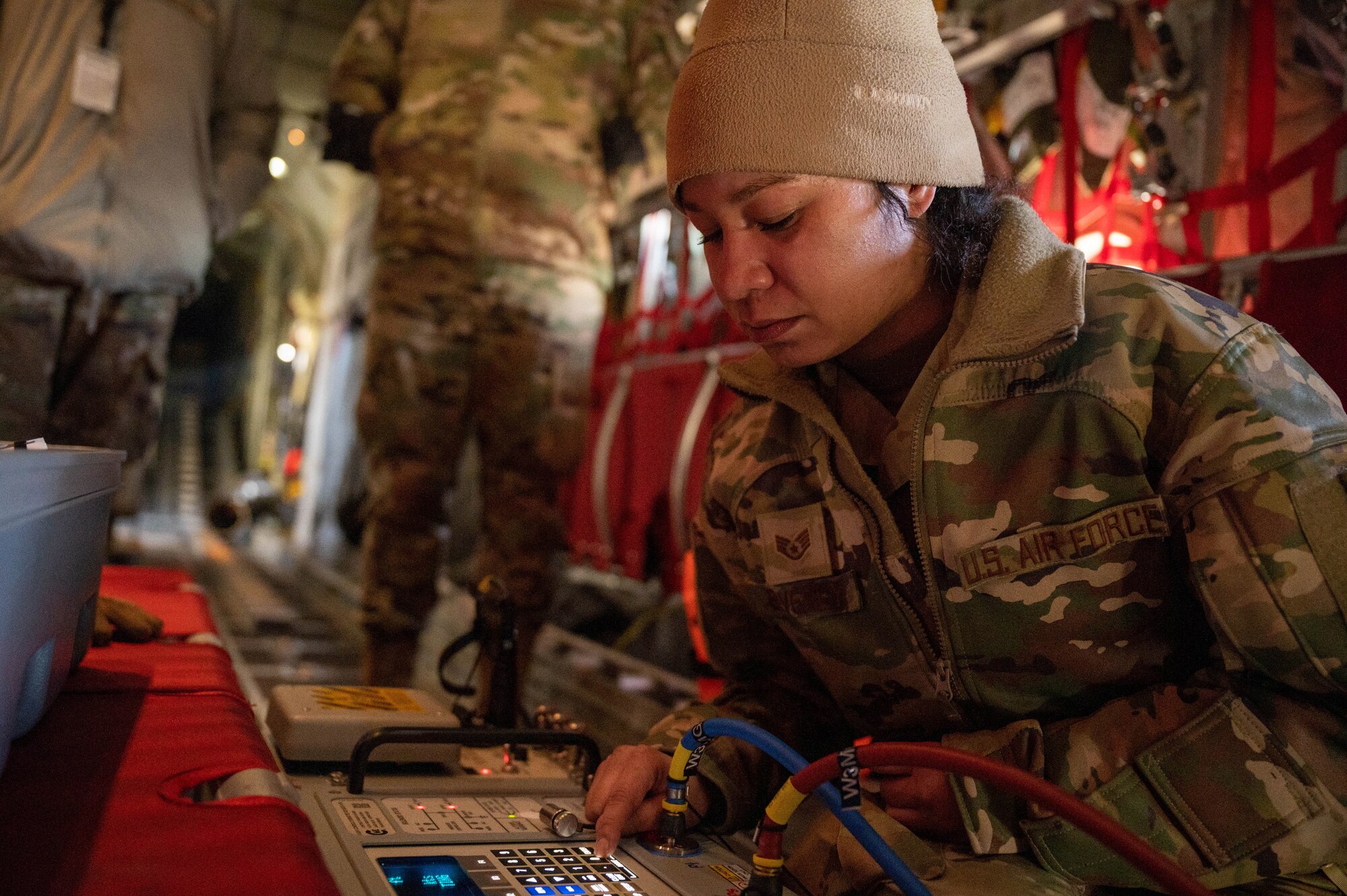 Staff Sgt. Rachelle Beverly, 934th Maintenance Squadron instruments and flight control systems technician, operates the air pressure system at Minneapolis-St. Paul Air Reserve Station, Feb. 2, 2023. This is used to check the operating system to make sure it works. (U.S. Air Force photo by Senior Airman Colten Tessness)