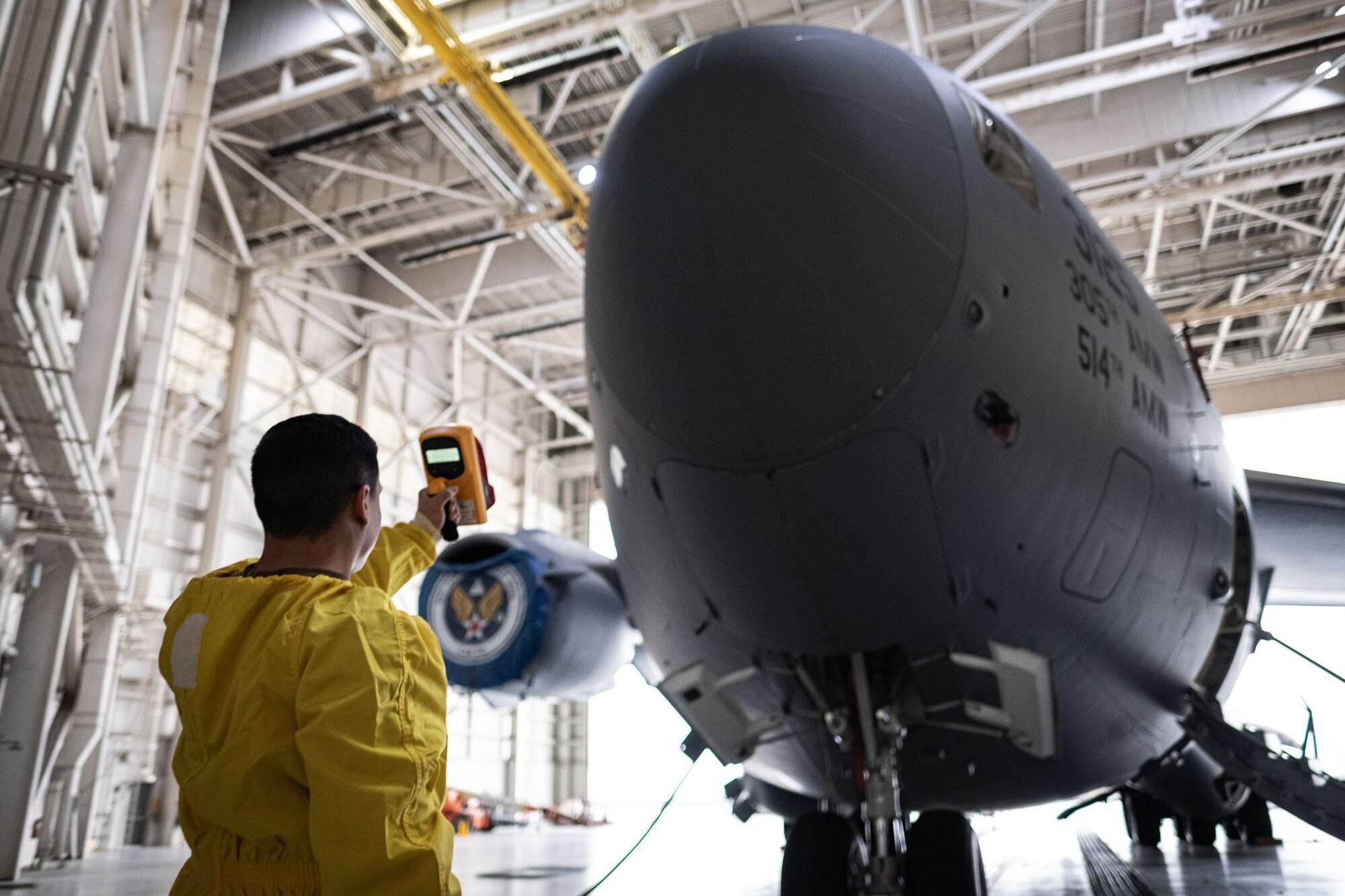 Man points tool at C-17