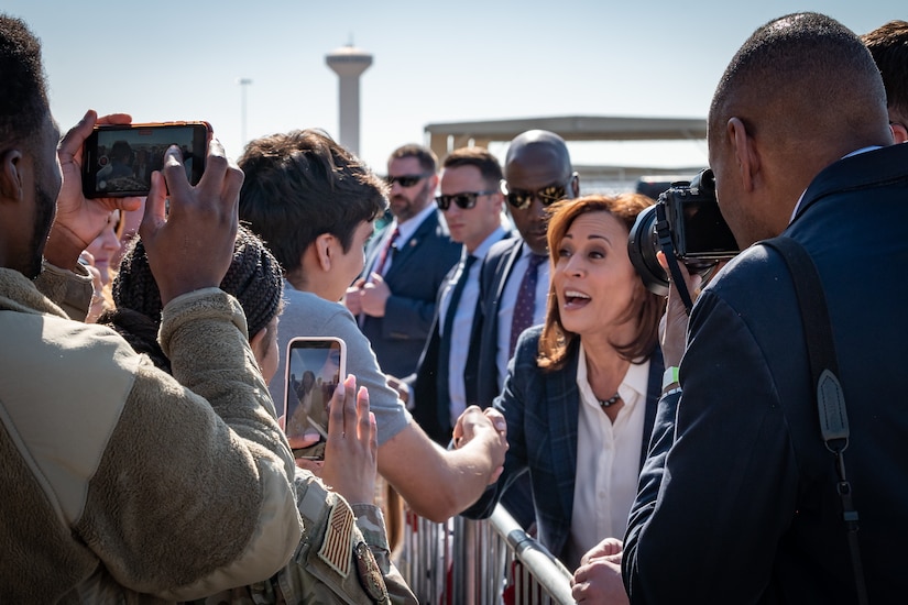 Vice President Kamala Harris greets a group of people.