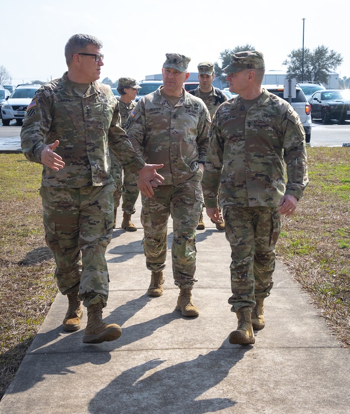 Gen. James E. Rainey (left), commanding general, Army Futures Command, speaks with Maj. Gen. Martin F. Klein, commanding general, 75th Innovation Command, U.S. Army Reserve as they enter 75th IC headquarters Feb. 14, 2022,  in Joint Reserve Base Ellington Field in Houston. The two generals outlined their commands’ respective vision and mission while discussing ways to synchronize their priorities to deliver the Army of 2030 and develop the Army 2040 that will dominate the land battlespace against any adversary. This and similar engagements among senior leaders helps ensure that the vision, mission and capabilities of the 75th IC align with those of AFC and U.S. Army Reserve Command. (U.S. Army photo by Staff Sgt. John L. Carkeet IV, 75th Innovation Command, U.S. Army Reserve)