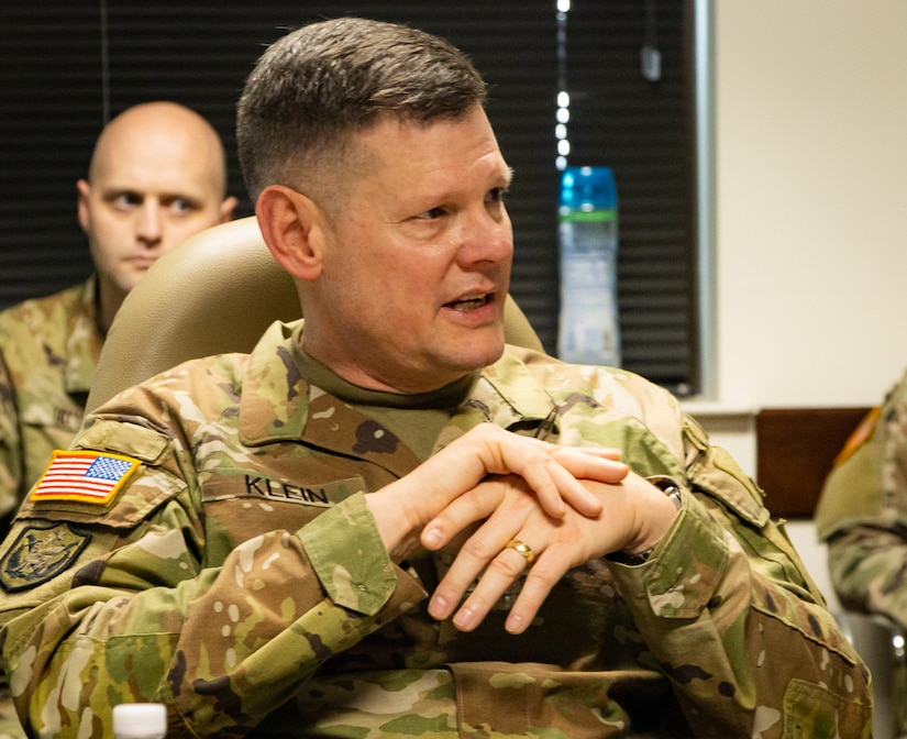 Maj. Gen. Martin F. Klein, commanding general, 75th Innovation Command, U.S. Army Reserve, explains the 75th IC’s philosophy of support to Gen. James E. Rainey, commanding general, Army Futures Command, during a briefing conducted 75th IC headquarters Feb. 14, 2022, in Joint Reserve Base Ellington Field in Houston. The 75th supports Army Futures Command through talent management, academic engagement, technical reconnaissance and protection and subject matter expertise and support. The two generals outlined their commands’ respective vision and mission while discussing ways to synchronize their priorities to deliver the Army of 2030 and develop the Army 2040 that will dominate the land battlespace against any adversary. This and similar engagements among senior leaders help ensure that the vision, mission and capabilities of the 75th IC align with those of AFC and U.S. Army Reserve Command. The mission of the 75th IC  is to rapidly enhance the strategic readiness of the Army by providing direct support to Army Futures Command's priorities: People, Design Army 2040, and Deliver Army 2030.  ​



​(U.S. Army photo by Staff Sgt. John L. Carkeet IV, 75th Innovation Command, U.S. Army Reserve)