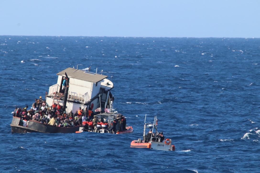 A Coast Guard small boat converges on the position of an overloaded 80-foot motor vessel, 30 miles northeast of Caibarien, Cuba, Feb. 15, 2022. There were over 300 people aboard the Haitian-suspected, migrant voyage vessel. (U.S. Coast Guard photo by Petty Officer 2nd Class Michael Mann)