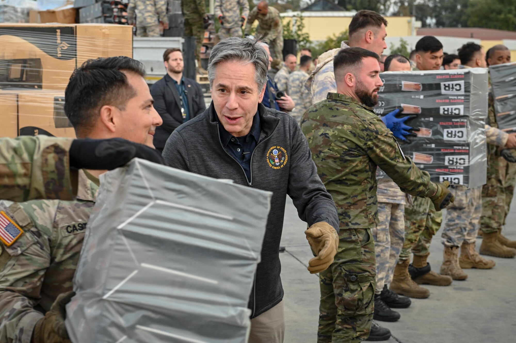 U.S. Secretary of State Antony J. Blinken assists with loading supplies at Incirlik Air base, Türkiye, Feb. 19, 2023.