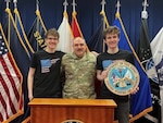 Idaho National Guard Col. Jim Hicks with his 19-year-old sons, Grayson, right, and Riley, Feb. 16, 2023, shortly after Hicks enlisted his sons into the Idaho Army National Guard at the Idaho Military Entrance Processing Station in Boise. The twins will serve in the same unit and military occupational specialty.