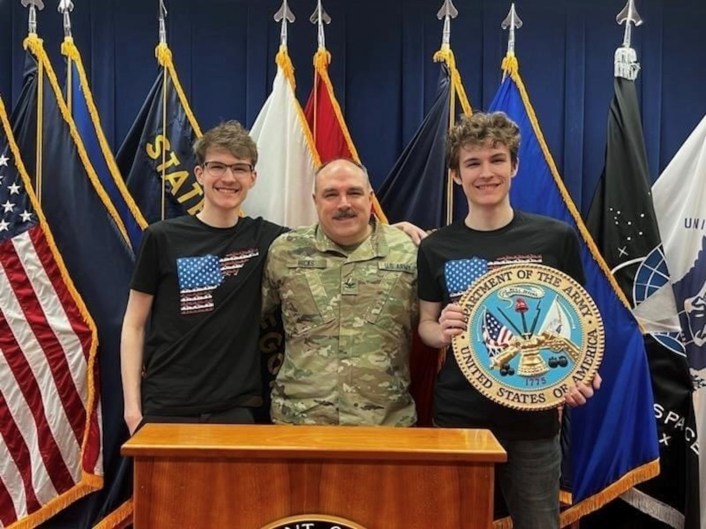 Idaho National Guard Col. Jim Hicks with his 19-year-old sons, Grayson, right, and Riley, Feb. 16, 2023, shortly after Hicks enlisted his sons into the Idaho Army National Guard at the Idaho Military Entrance Processing Station in Boise. The twins will serve in the same unit and military occupational specialty.
