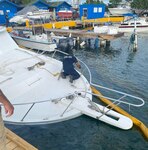 Coast Guard Incident Management personnel from Sector San Juan respond to a diesel discharge from the partially sunken 42-foot recreational vessel Ajo del País at Pier 11 in San Juan Harbor Feb. 21, 2023. The Coast Guard activated the Oil Spill Liability Trust Fund and contracted Clean Harbors LLC as the Oil Spill Removal Organization, while cleanup crews have installed containment and absorbent boom around the vessel and will be looking to recover any remaining fuel from inside the vessel tanks.