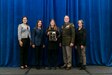 Photo of  Environmental Engineer Amalia Thomas accepting an award.