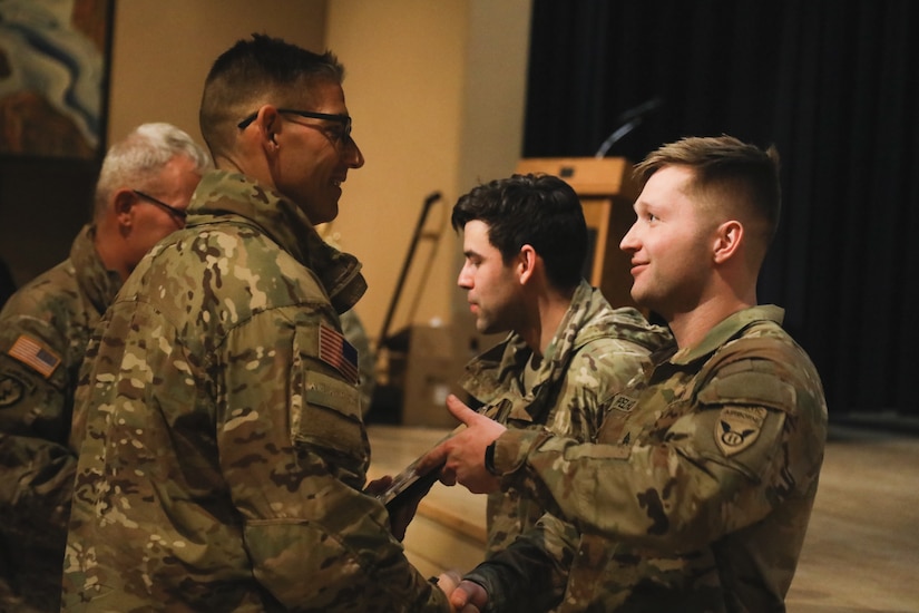 Sgt. Ryan Applehof, Baker Company, 3rd Battalion, 509th Infantry Regiment, 2nd Brigade Combat Team, receives an award for coming in first place of the Annual Arctic Angels Winter Games on Feb. 2, 2023 on Joint Base Elmendorf-Richardson.