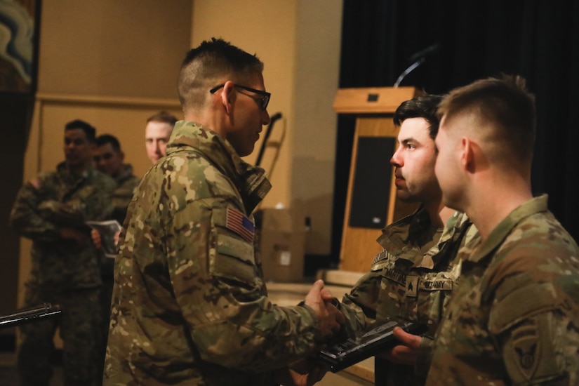 Sgt. Joshua Martinez, Baker Company, 3rd Battalion, 509th Infantry Regiment, 2nd Brigade Combat Team, receives an award for coming in first place in the Annual Arctic Angels Winter Games on Feb. 2,