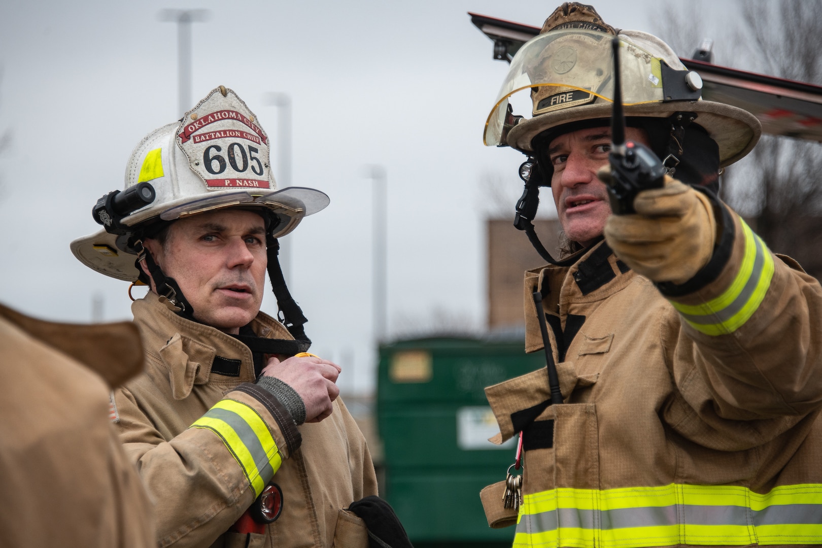 two firefighters talk