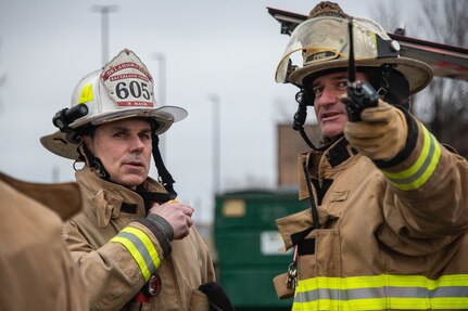 two firefighters talk