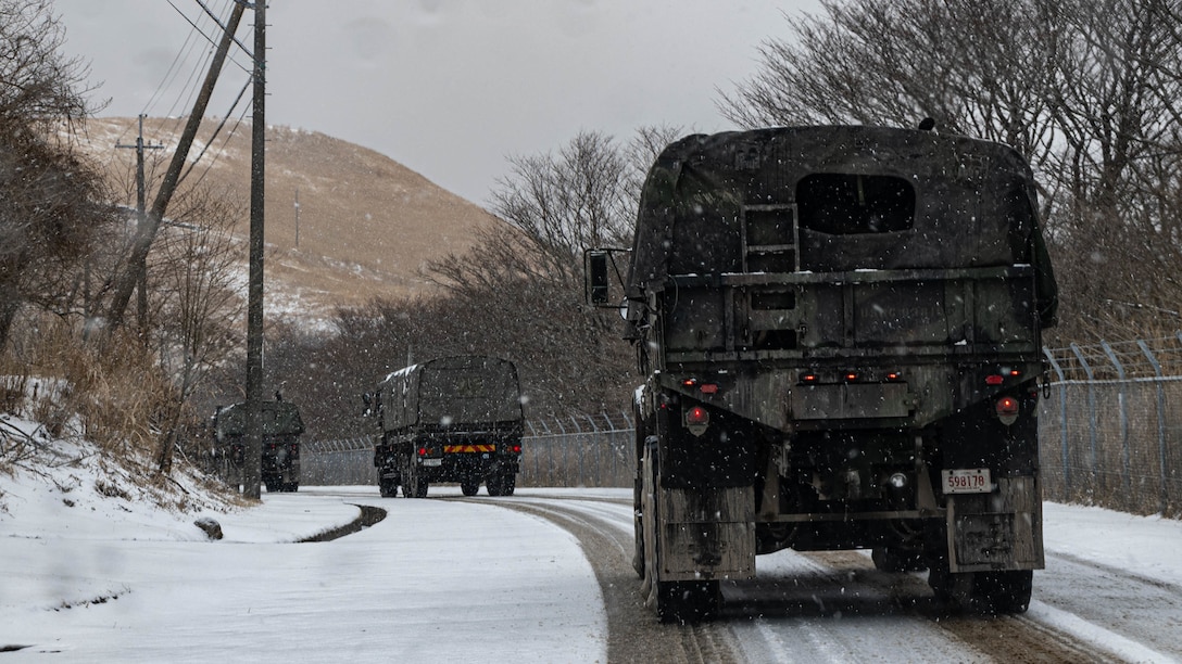 U.S. Marines in Medium Tactical Vehicle Replacement and Japanese Amphibious Rapid Deployment Brigade soldiers in type 73 medium truck support bilateral convoy operations during Iron Fist 23 at Hijudai, Japan, Feb. 21, 2023. The convoy operations moved both U.S. and Japanese supplies and personnel to operational locations throughout Hijudai. Iron Fist is an annual bilateral exercise designed to increase interoperability and strengthen the relationships between the U.S. Marine Corps, the U.S. Navy, the Japan Ground Self-Defense Force, and the Japan Maritime Self-Defense Force. (U.S. Marine Corps photo by Lance Cpl. William N. Wallace)